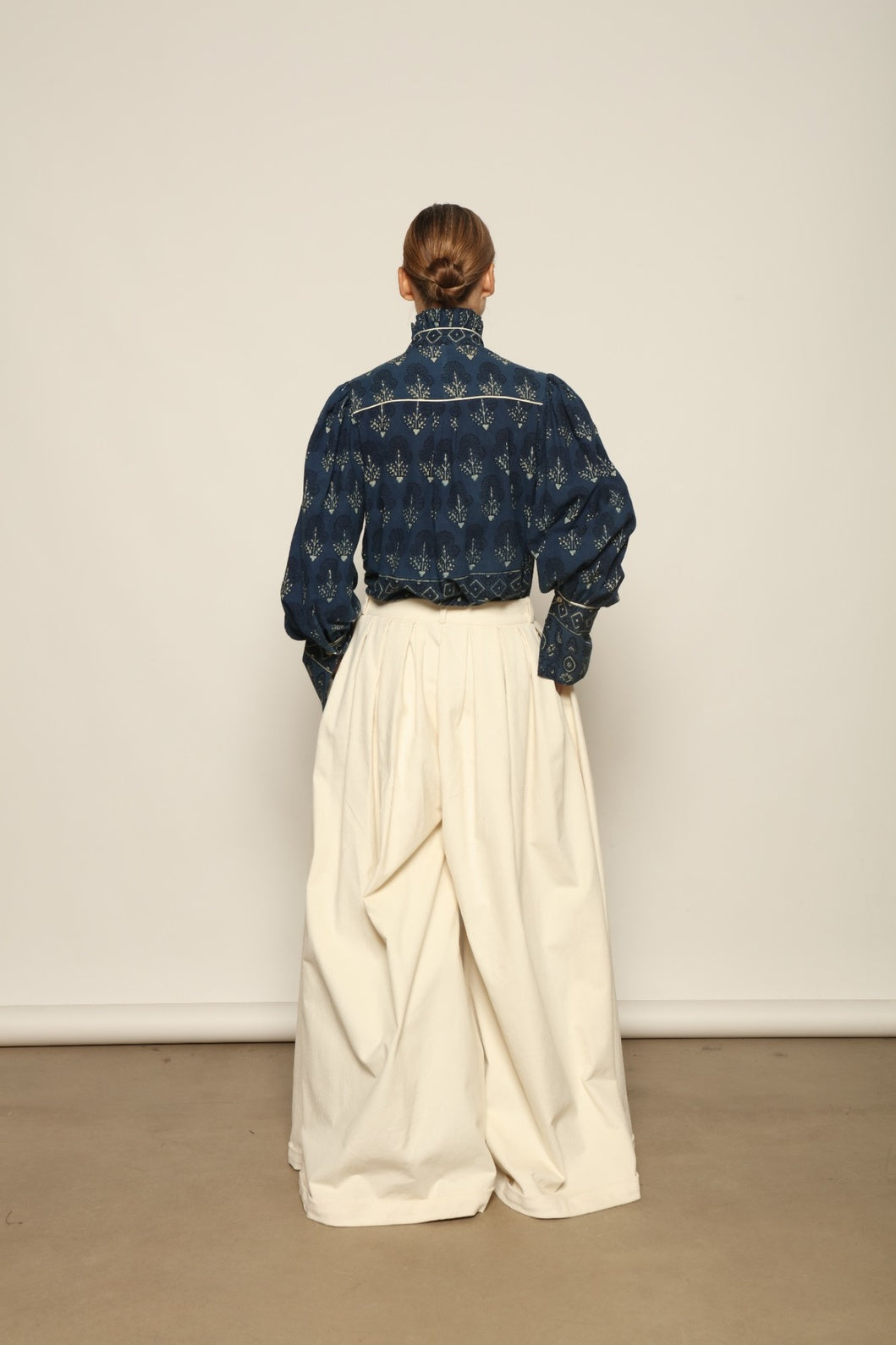 Karin Pure Organic Cotton Blouse with Volant by House of Nomad Stories, made in Italy from 100% organic cotton with traditional Ajrakh block printing, natural indigo dye, black and white accents, and a feminine volant detail.