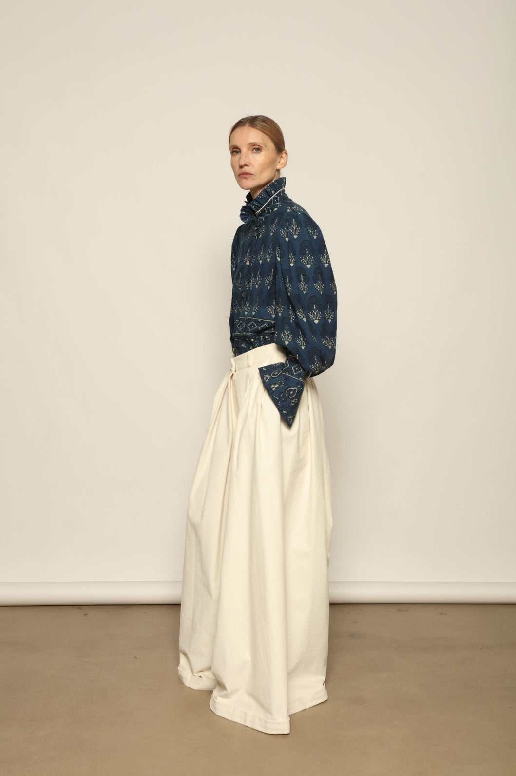 Karin Pure Organic Cotton Blouse with Volant by House of Nomad Stories, made in Italy from 100% organic cotton with traditional Ajrakh block printing, natural indigo dye, black and white accents, and a feminine volant detail.