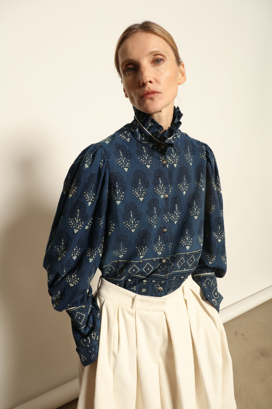 Karin Pure Organic Cotton Blouse with Volant by House of Nomad Stories, made in Italy from 100% organic cotton with traditional Ajrakh block printing, natural indigo dye, black and white accents, and a feminine volant detail.