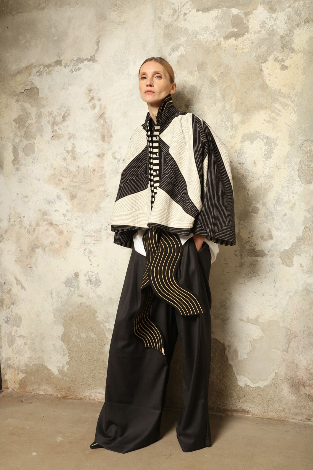 Model is wearing the Tri Crop Moma in black by Ka-Sha, a sculptural heavyweight organic cotton cropped top with geometric panels, curated in the House of Woven Stories selection.