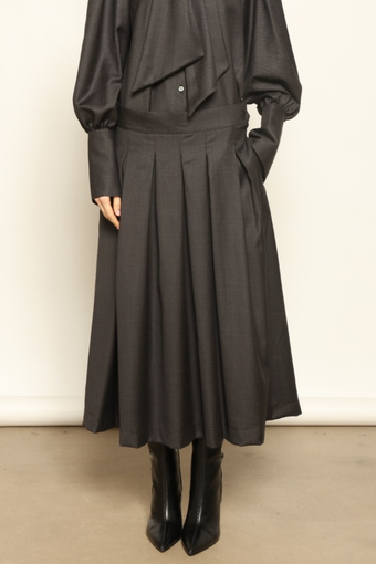 Larissa Super 100% Merino Wool Skirt by House of Nomad Stories – midi-length pleated skirt in soft, luxurious merino wool, tailored in Piemonte, Italy for timeless elegance and comfort.