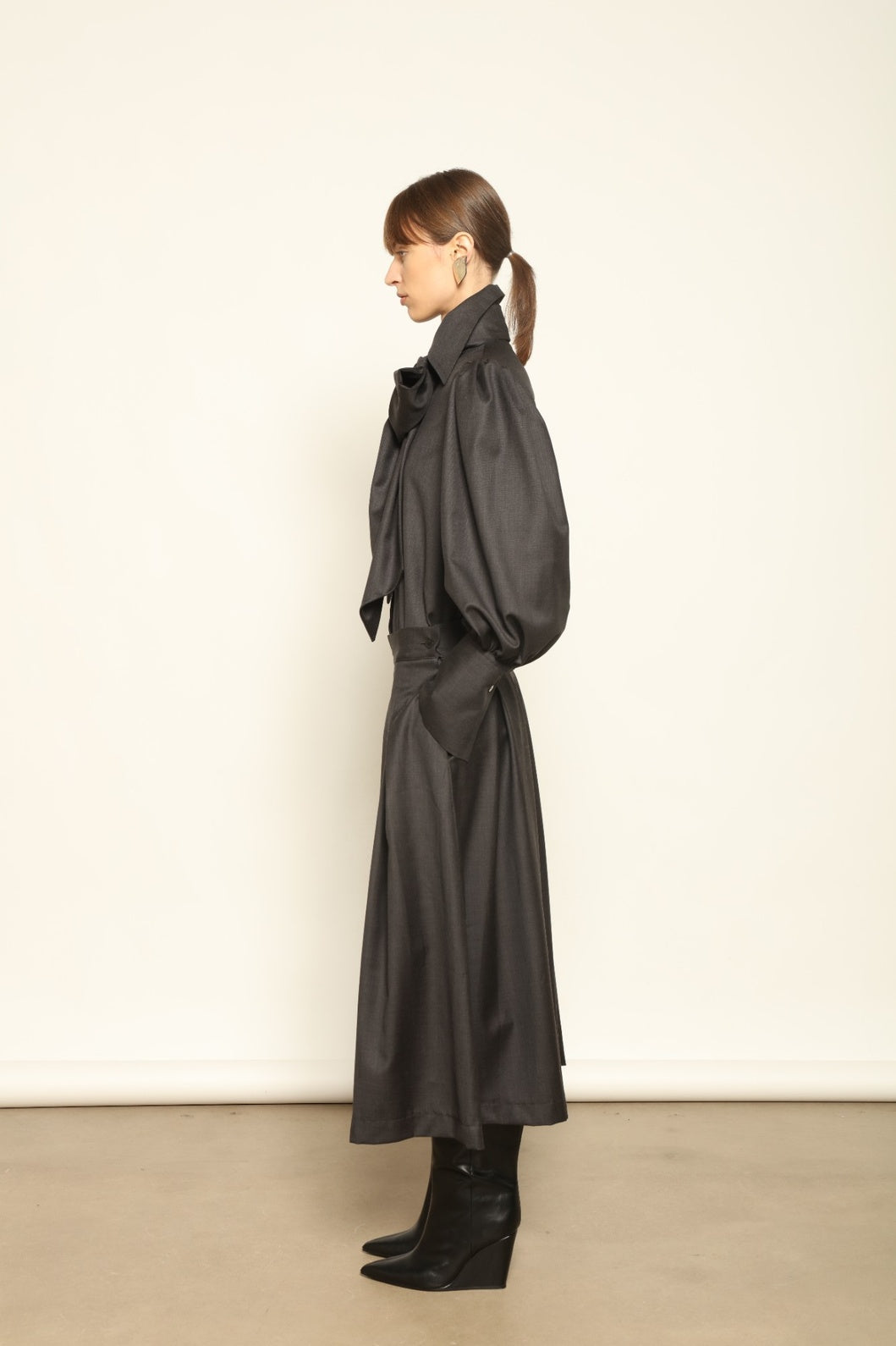 Larissa Super 100% Merino Wool Skirt by House of Nomad Stories – midi-length pleated skirt in soft, luxurious merino wool, tailored in Piemonte, Italy for timeless elegance and comfort.