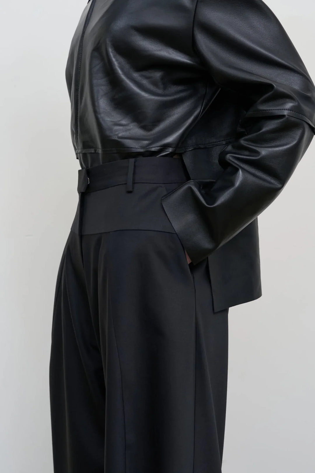 Model is wearing Litkovska high-rise wool wide-leg black pants showcasing contemporary tailoring and designer womenswear at House of Nomad Stories