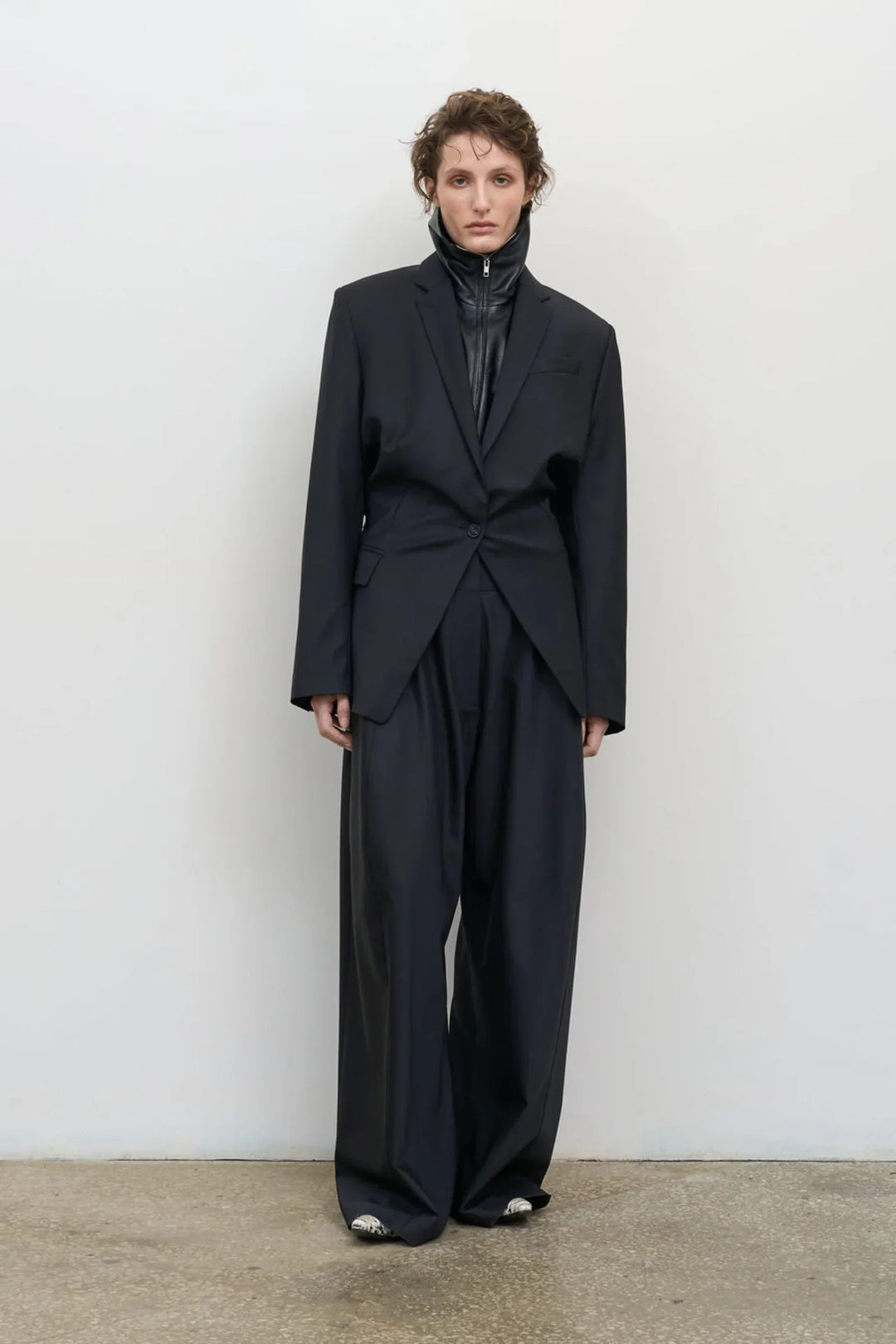 Model is wearing Litkovska high-rise wool wide-leg black pants showcasing contemporary tailoring and designer womenswear at House of Nomad Stories