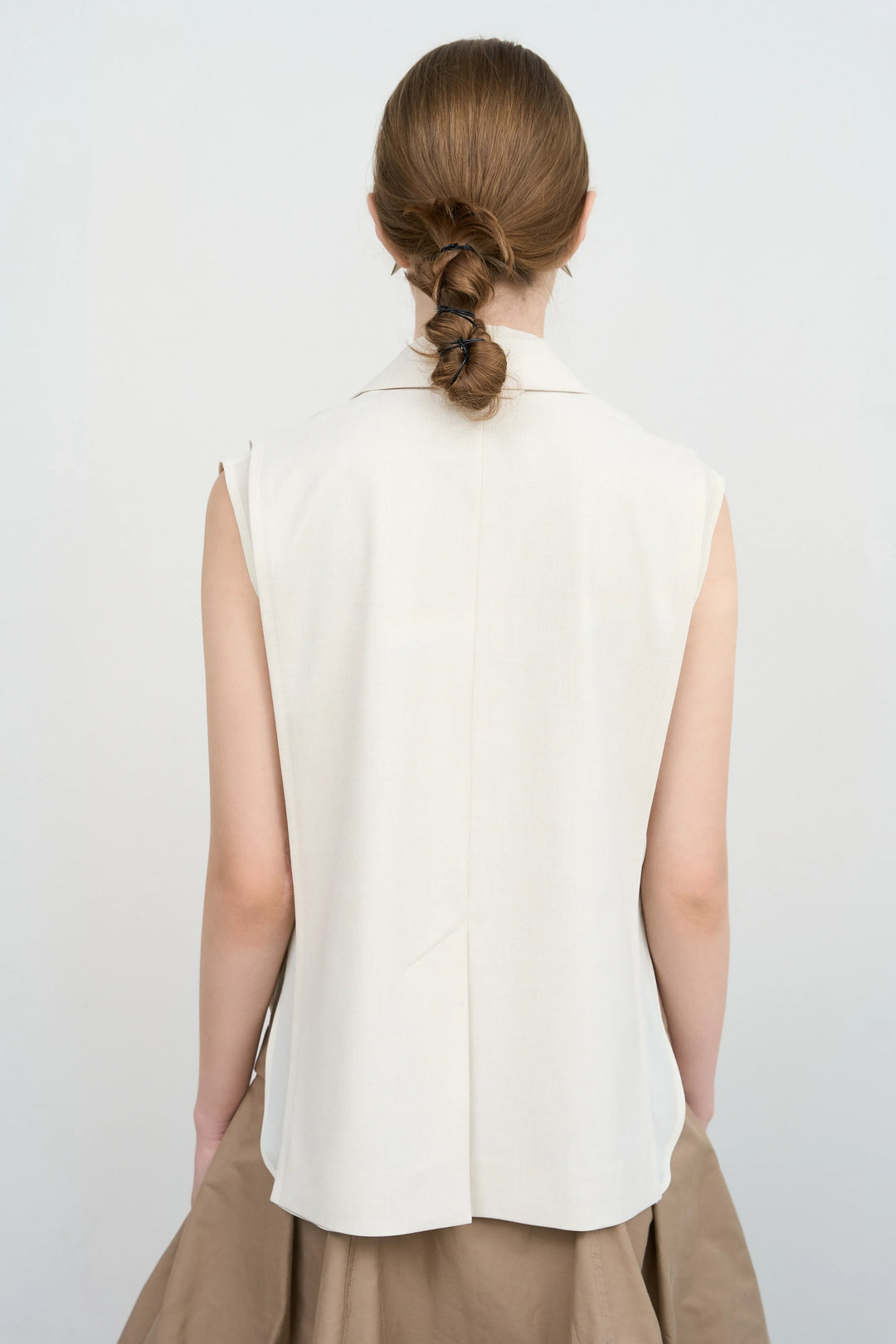 Model is wearing Litkovska sleeveless layered vest with sculptural construction selected by House of Nomad Stories