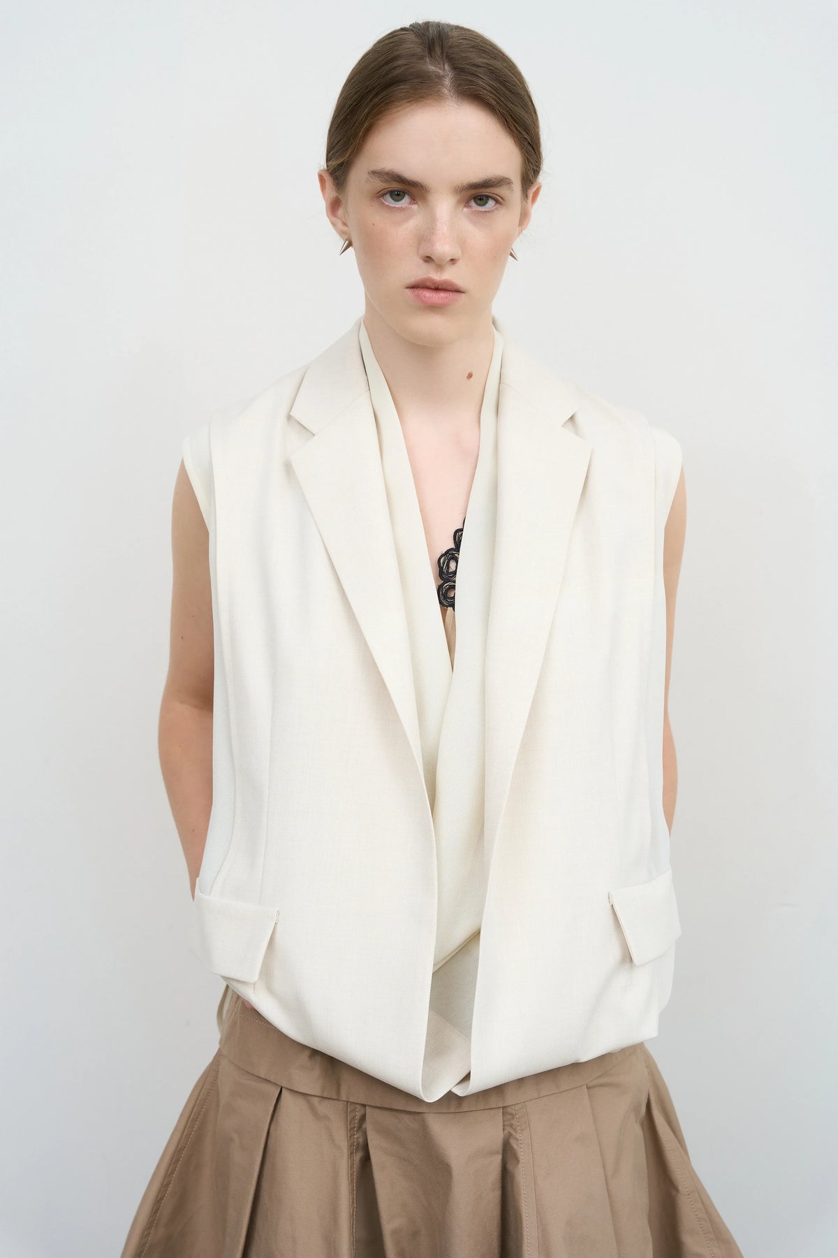Model is wearing Litkovska sleeveless layered vest with sculptural construction selected by House of Nomad Stories