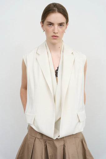 Model is wearing Litkovska sleeveless layered vest with sculptural construction selected by House of Nomad Stories