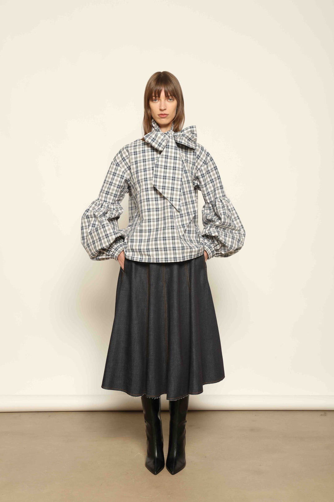 Model wearing Lulu Maxi Check Popeline Cotton Blouse with Scarf by House of Woven Stories, featuring balloon sleeves, grey-white-indigo check, and versatile scarf detail.