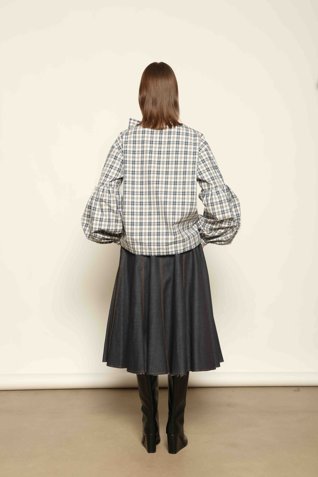 Model wearing Lulu Maxi Check Popeline Cotton Blouse with Scarf by House of Woven Stories, featuring balloon sleeves, grey-white-indigo check, and versatile scarf detail.