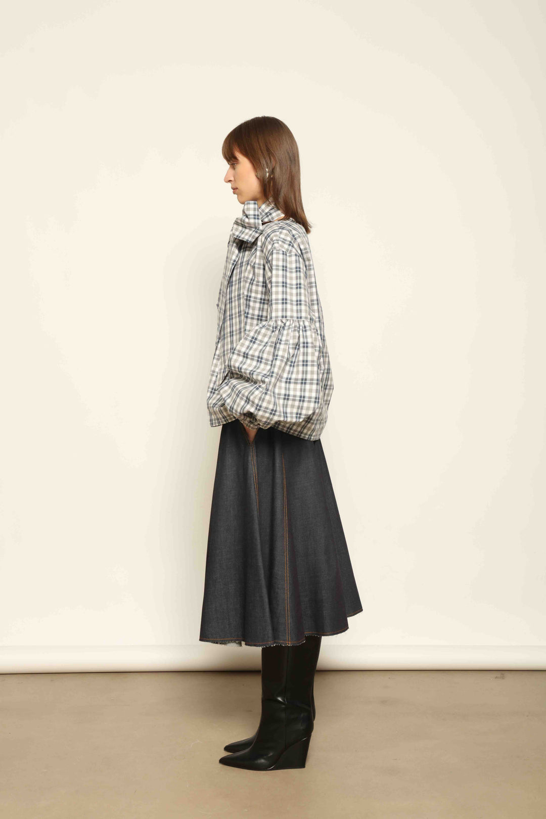 Model wearing Lulu Maxi Check Popeline Cotton Blouse with Scarf by House of Woven Stories, featuring balloon sleeves, grey-white-indigo check, and versatile scarf detail.
