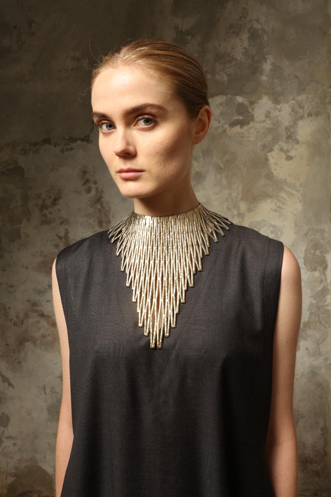 Luminous Gold Necklace by SO-LE STUDIO, handcrafted in Italy from upcycled Ferragamo leather, featuring a sculptural gold-tone design that embodies sustainable luxury and contemporary elegance.