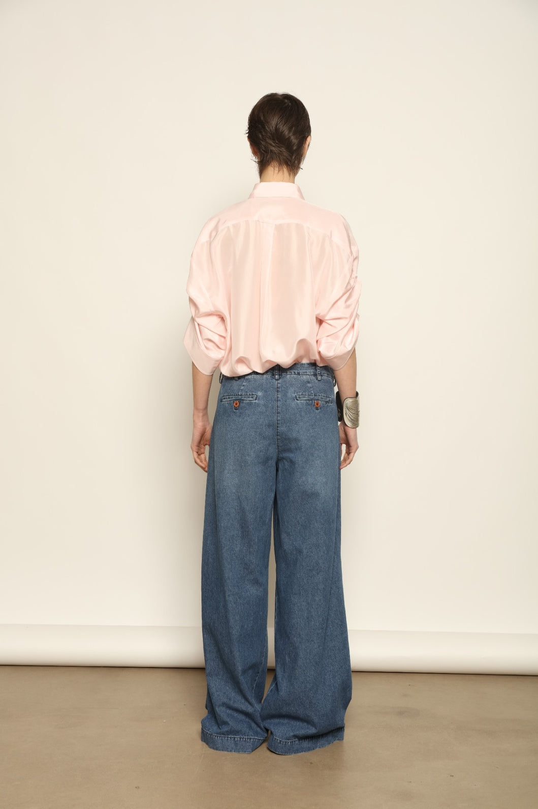 Buba Shirt by Maison Jejia in fluid silk, featuring a softly draped silhouette, delicate ruffle detailing at the sleeves and a light, airy finish, available in Pink and Vanilla and made in Italy.