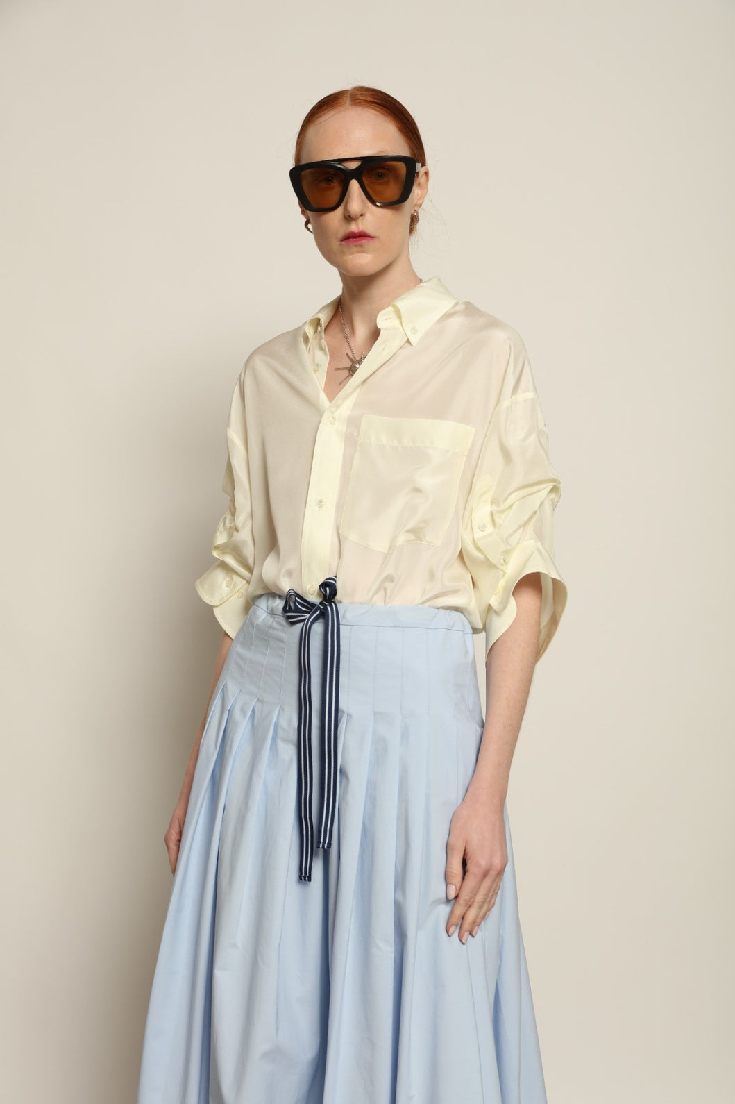 Buba Shirt by Maison Jejia in fluid silk, featuring a softly draped silhouette, delicate ruffle detailing at the sleeves and a light, airy finish, available in Pink and Vanilla and made in Italy.