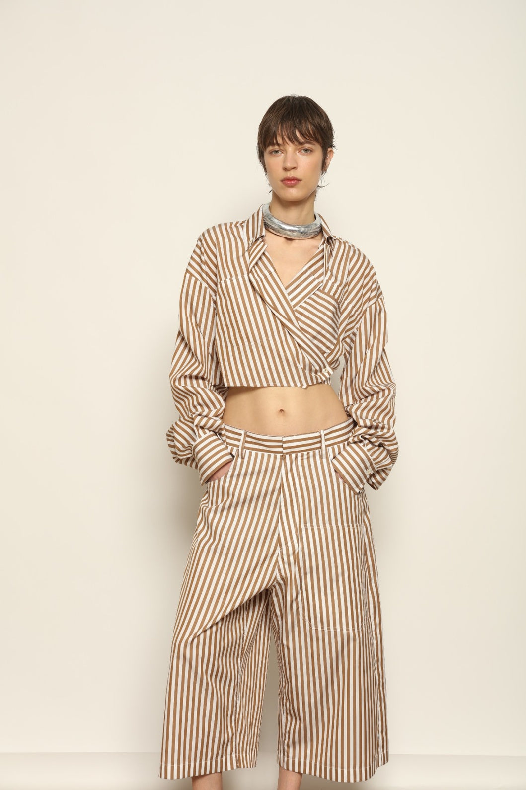 Carla Rust Striped Cotton Bermuda by Maison Jejia, crafted in soft cotton with warm rust and white stripes, a structured waistband, oversized patch pockets and a relaxed knee-length silhouette.