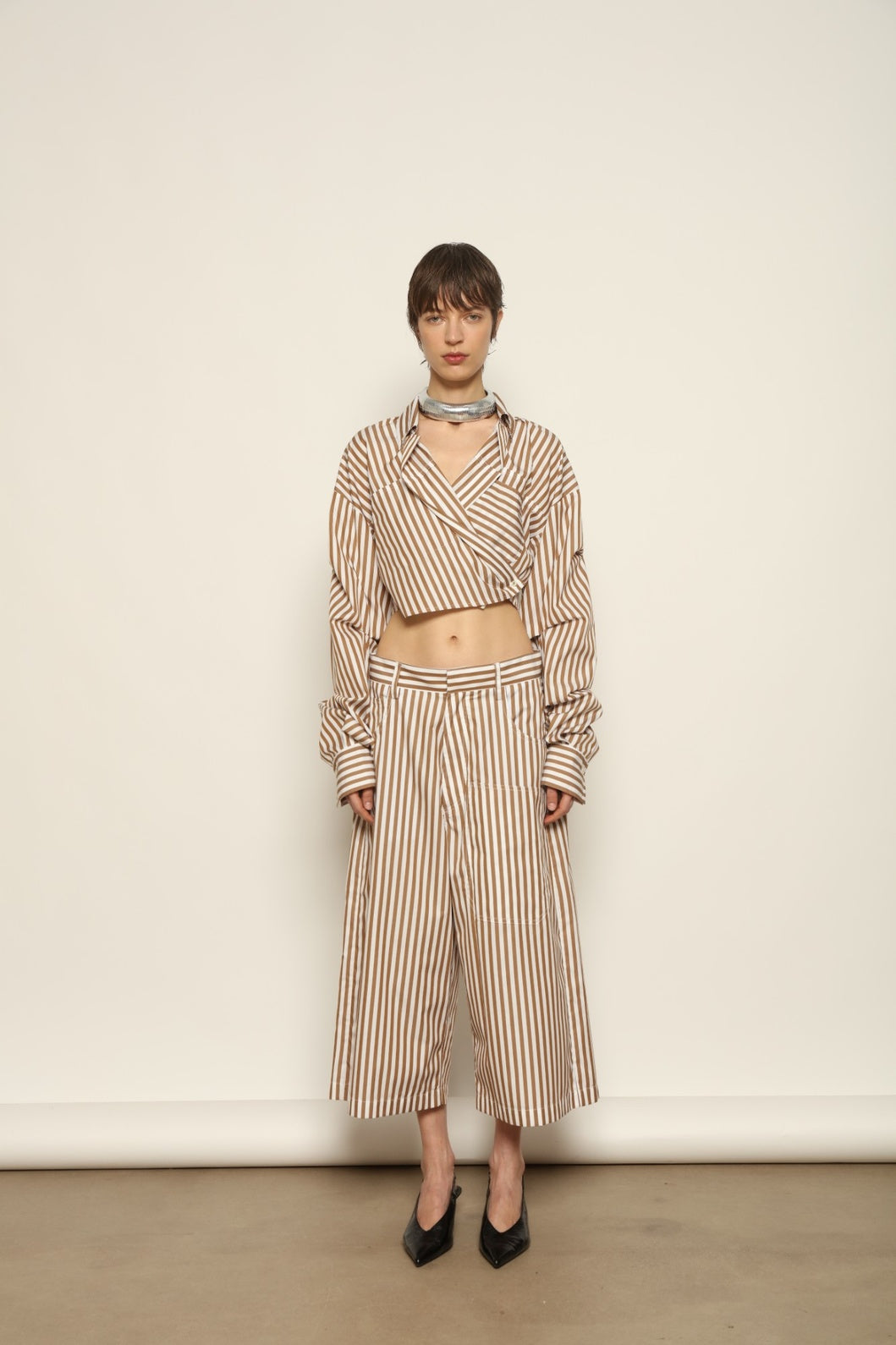 Carla Rust Striped Cotton Bermuda by Maison Jejia, crafted in soft cotton with warm rust and white stripes, a structured waistband, oversized patch pockets and a relaxed knee-length silhouette.