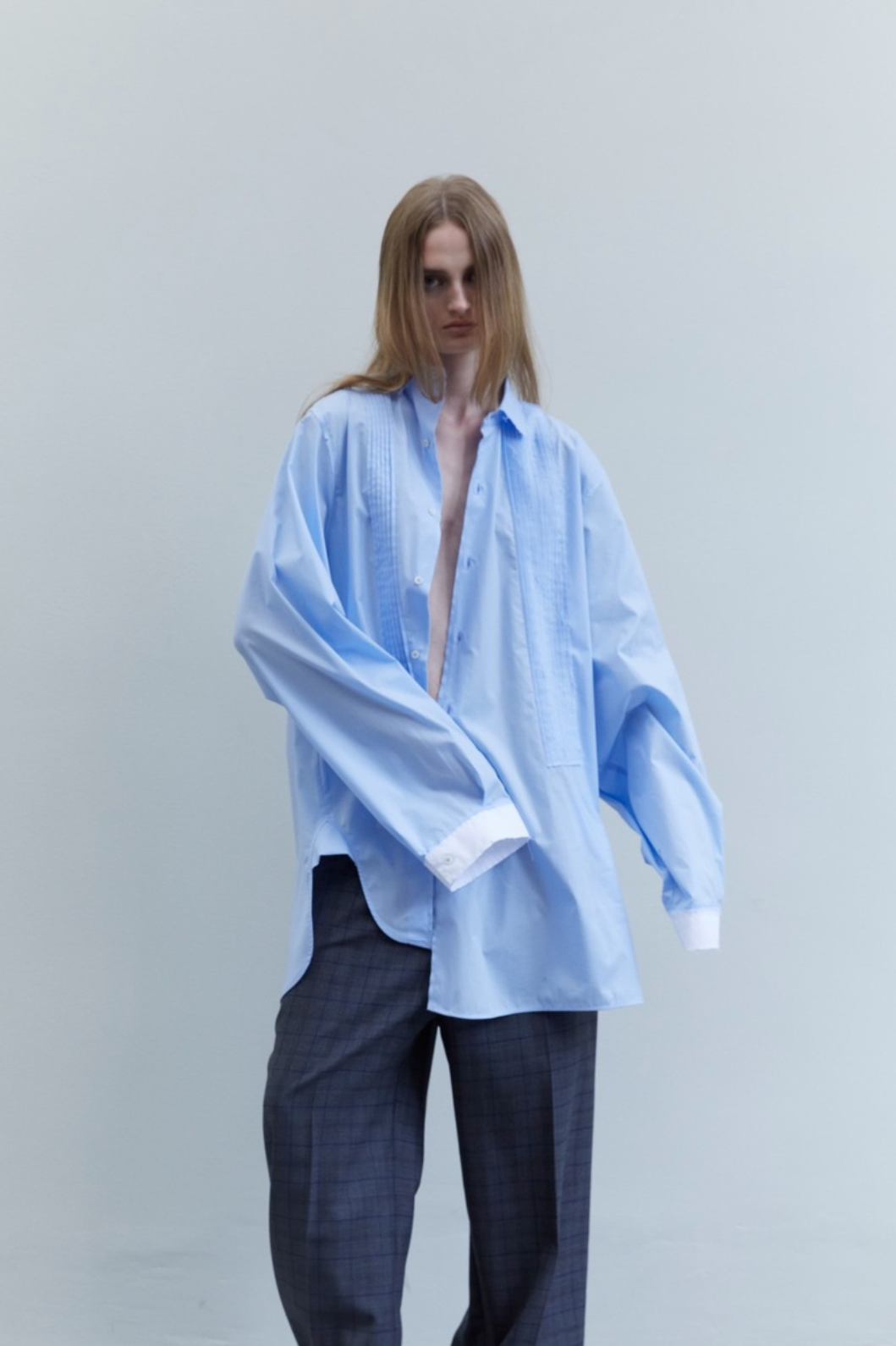 Crazy Smoking Sky Blue Plissé Shirt by Maison Jejia, front view showing the oversized silhouette, soft cotton fabric and delicate plissé texture.