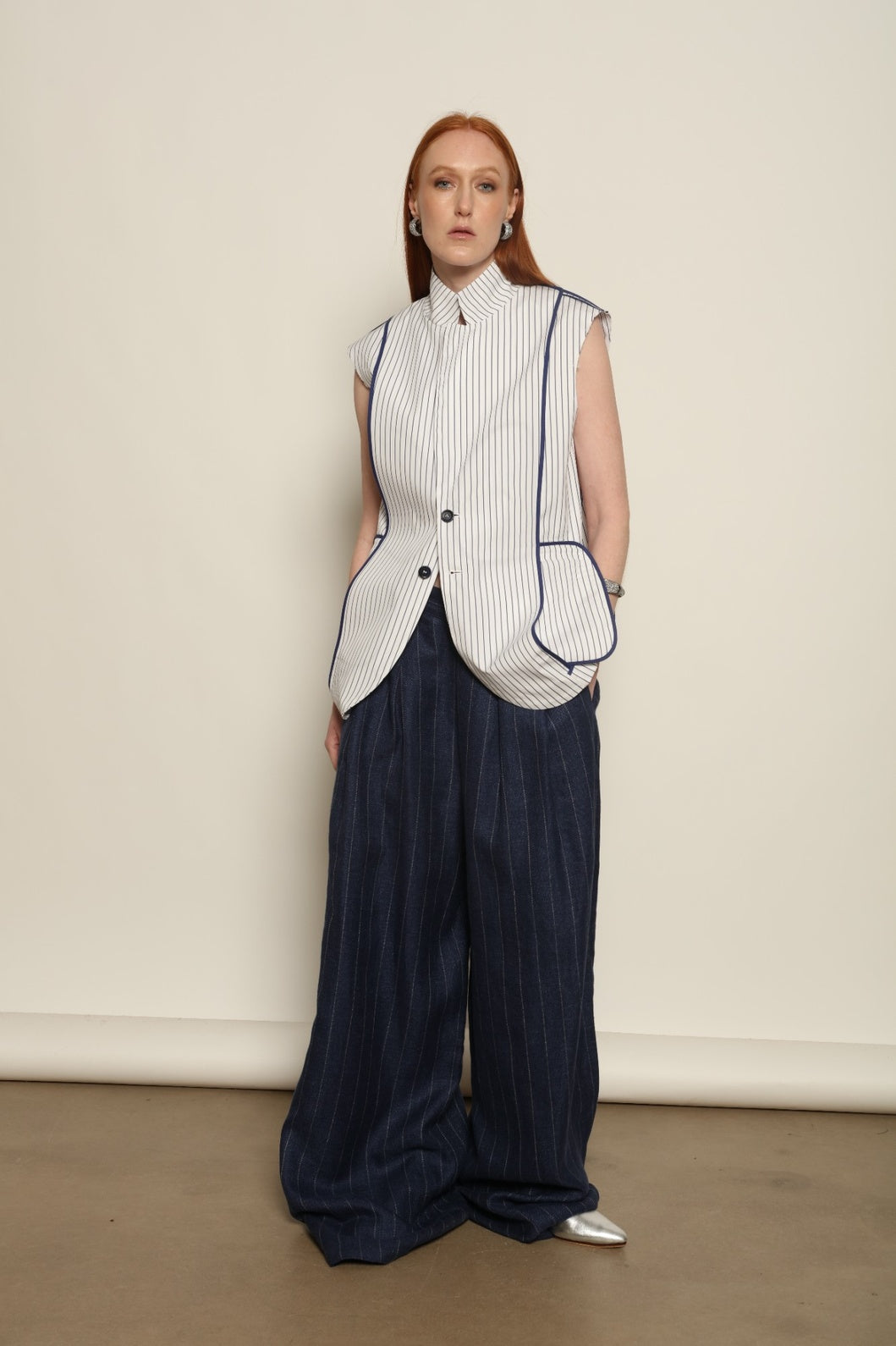 Harry Gilet by Maison Jejia in crisp white cotton with fine blue stripes and a clean sleeveless tailored silhouette.