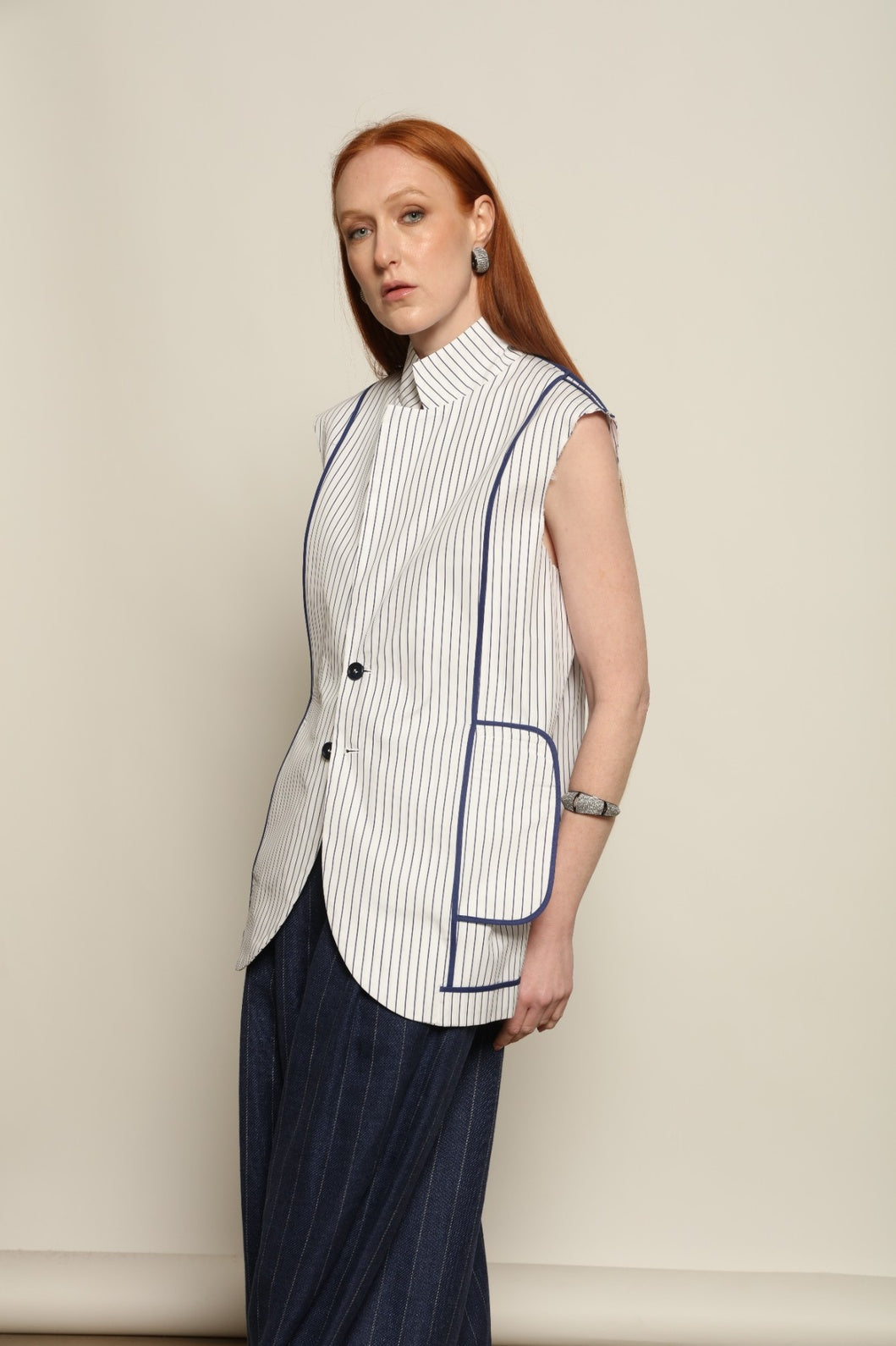 Harry Gilet by Maison Jejia, a modern striped layering piece that can be worn over shirts or styled on its own.