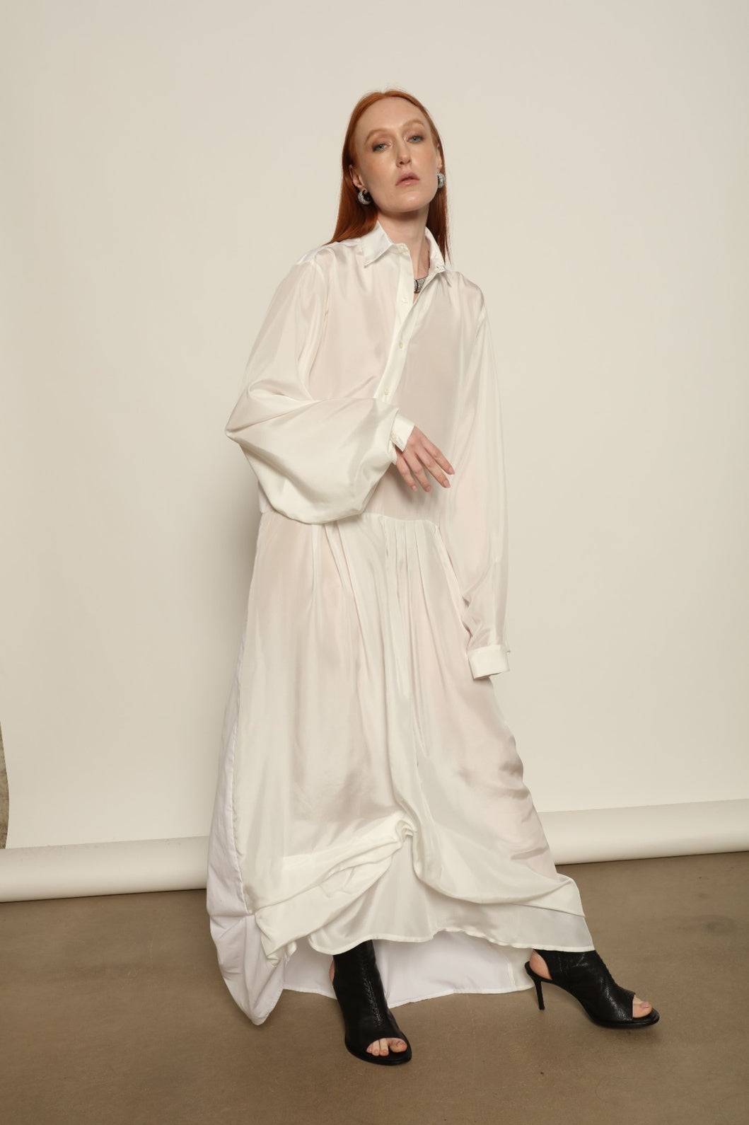 Tina Silk Dress by Maison Jejia with a flowing hem that enhances the natural movement of the silk.