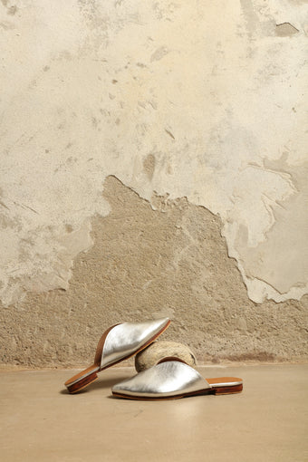 Silver Majorel Slippers by House of Nomad Stories, handcrafted in Marrakesh from metallic leather with a leather sole, cushioned insole, and subtle heel.