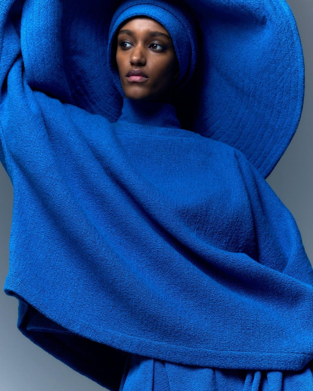French Blue Bouclé Sweater by Marrakshi Life offering lightweight warmth with a soft and cozy texture.