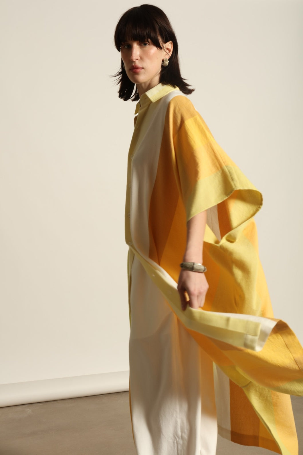 Sleeveless Caftan Stripe 44 by Marrakshi Life in 100% cotton, featuring sun-washed multicolour stripes, a clean sleeveless cut and a relaxed, fluid silhouette designed for warm-weather ease.