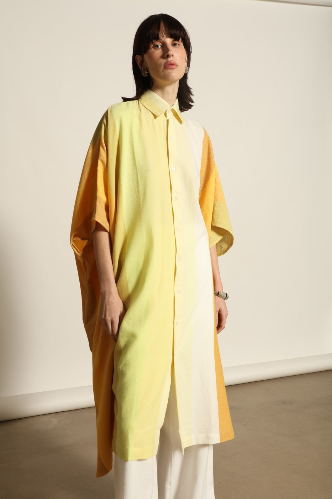Sleeveless Caftan Stripe 44 by Marrakshi Life in 100% cotton, featuring sun-washed multicolour stripes, a clean sleeveless cut and a relaxed, fluid silhouette designed for warm-weather ease.