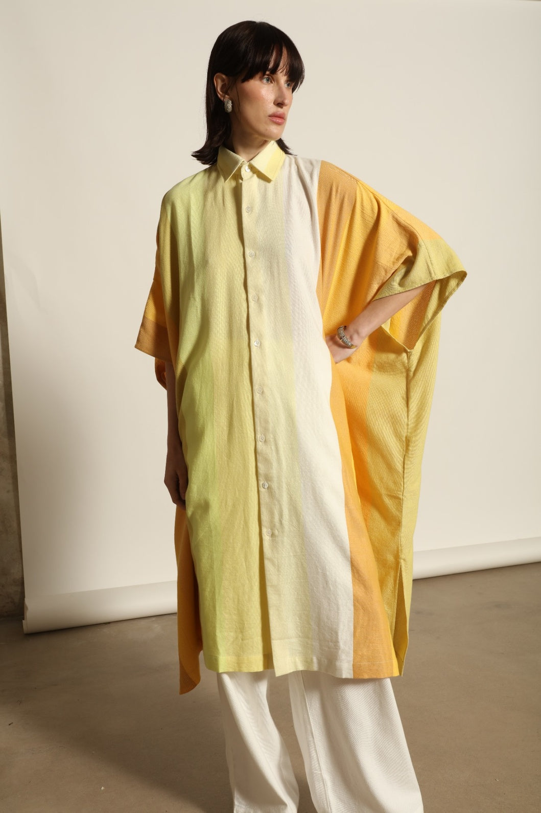 Sleeveless Caftan Stripe 44 by Marrakshi Life in 100% cotton, featuring sun-washed multicolour stripes, a clean sleeveless cut and a relaxed, fluid silhouette designed for warm-weather ease.
