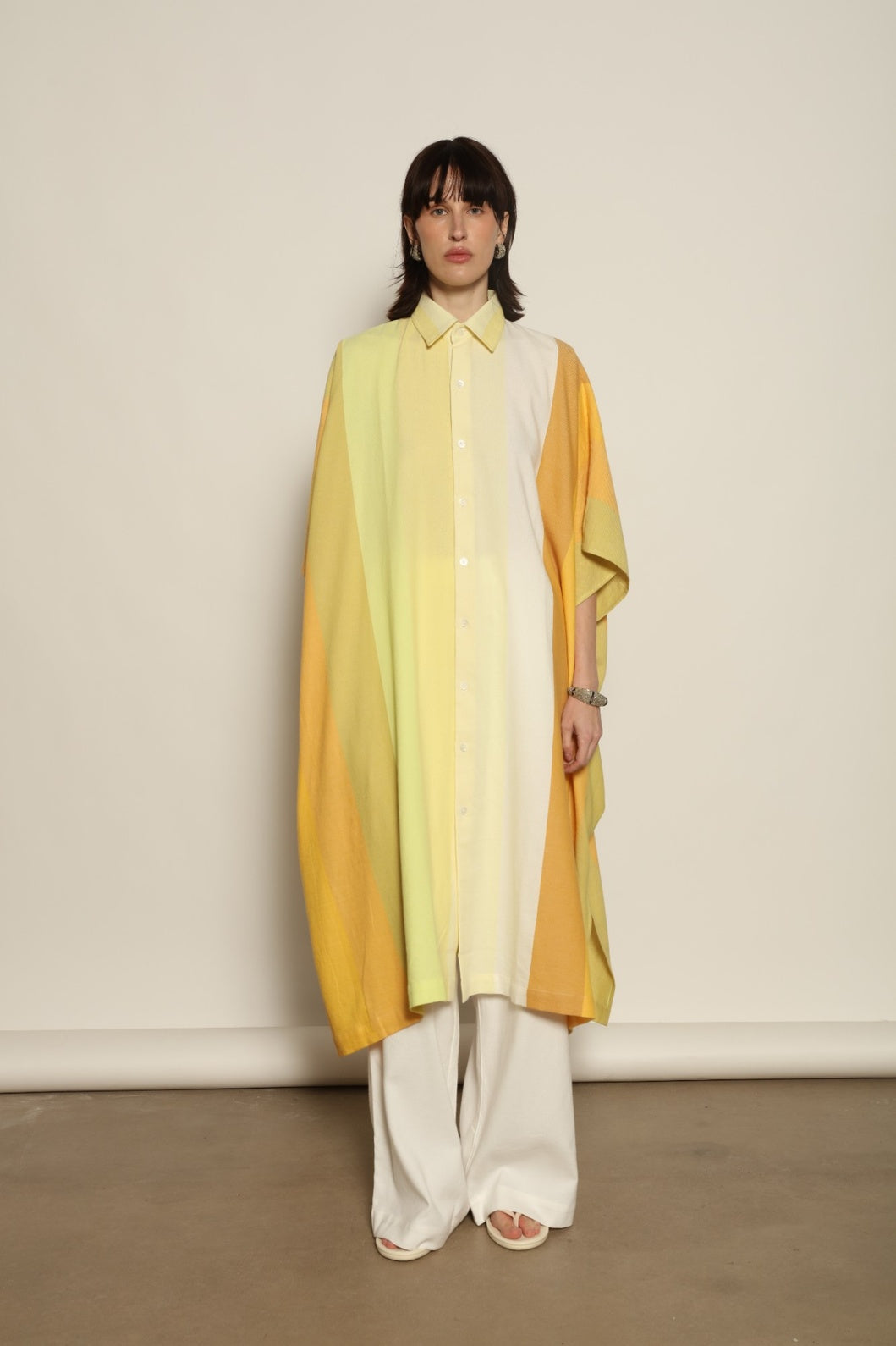 Sleeveless Caftan Stripe 44 by Marrakshi Life in 100% cotton, featuring sun-washed multicolour stripes, a clean sleeveless cut and a relaxed, fluid silhouette designed for warm-weather ease.
