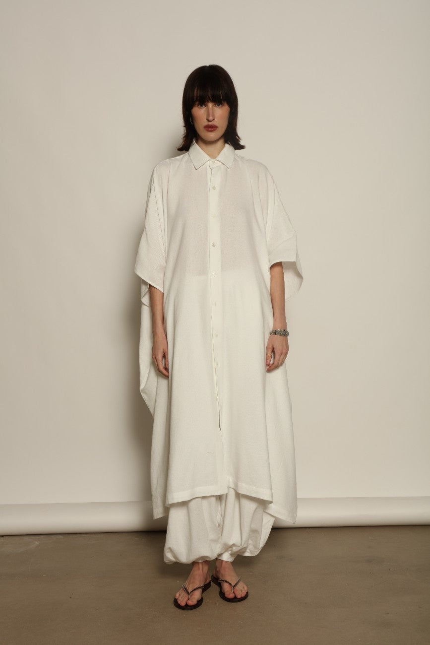 Sleeveless Caftan in White Solid by Marrakshi Life, crafted in Morocco from 100% cotton with a clean sleeveless cut, soft fluid drape and relaxed full-length silhouette.