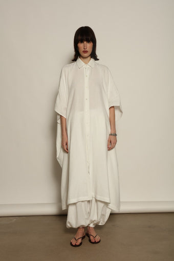 Sleeveless Caftan in White Solid by Marrakshi Life, crafted in Morocco from 100% cotton with a clean sleeveless cut, soft fluid drape and relaxed full-length silhouette.
