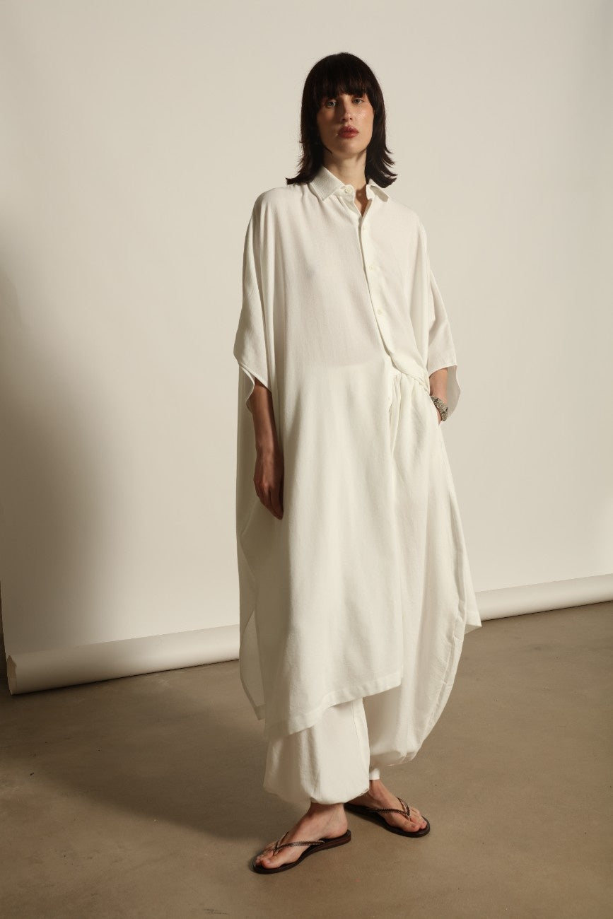 Sleeveless Caftan in White Solid by Marrakshi Life, crafted in Morocco from 100% cotton with a clean sleeveless cut, soft fluid drape and relaxed full-length silhouette.