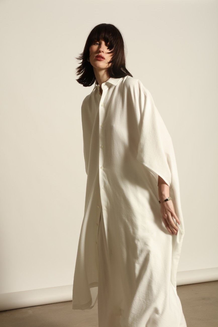 Sleeveless Caftan in White Solid by Marrakshi Life, crafted in Morocco from 100% cotton with a clean sleeveless cut, soft fluid drape and relaxed full-length silhouette.