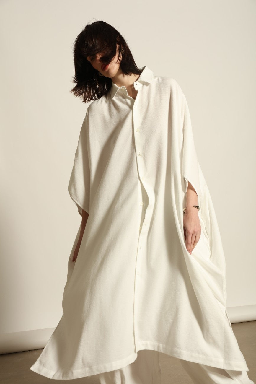 Sleeveless Caftan in White Solid by Marrakshi Life, crafted in Morocco from 100% cotton with a clean sleeveless cut, soft fluid drape and relaxed full-length silhouette.