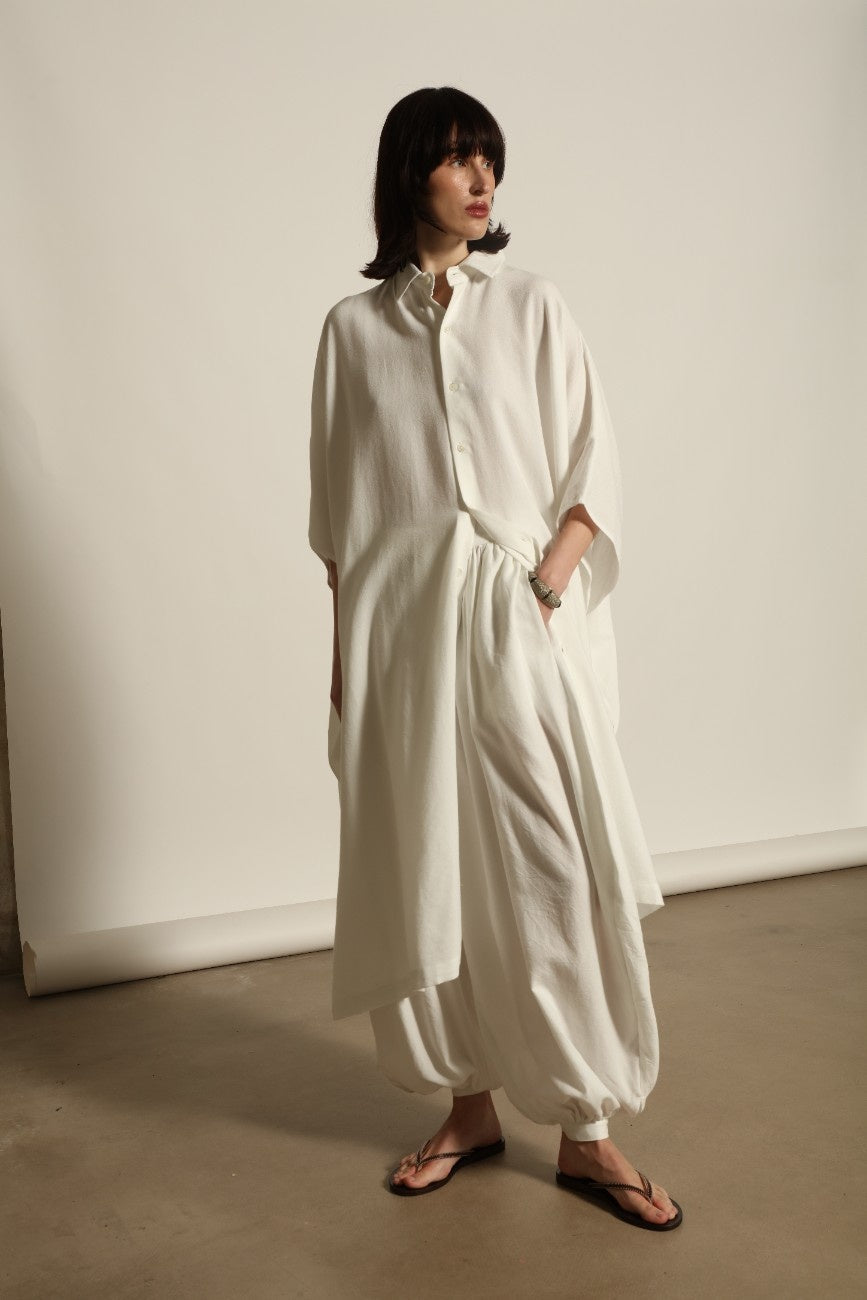Sleeveless Caftan in White Solid by Marrakshi Life, crafted in Morocco from 100% cotton with a clean sleeveless cut, soft fluid drape and relaxed full-length silhouette.