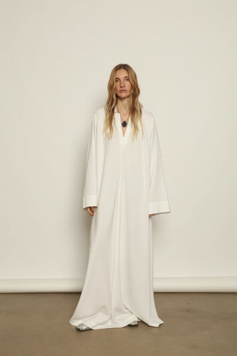 V-Neck Ecru Caftan by Marrakshi Life, handcrafted in Marrakesh with a soft ecru tone, flowing silhouette, wide sleeves and a clean V-neckline.