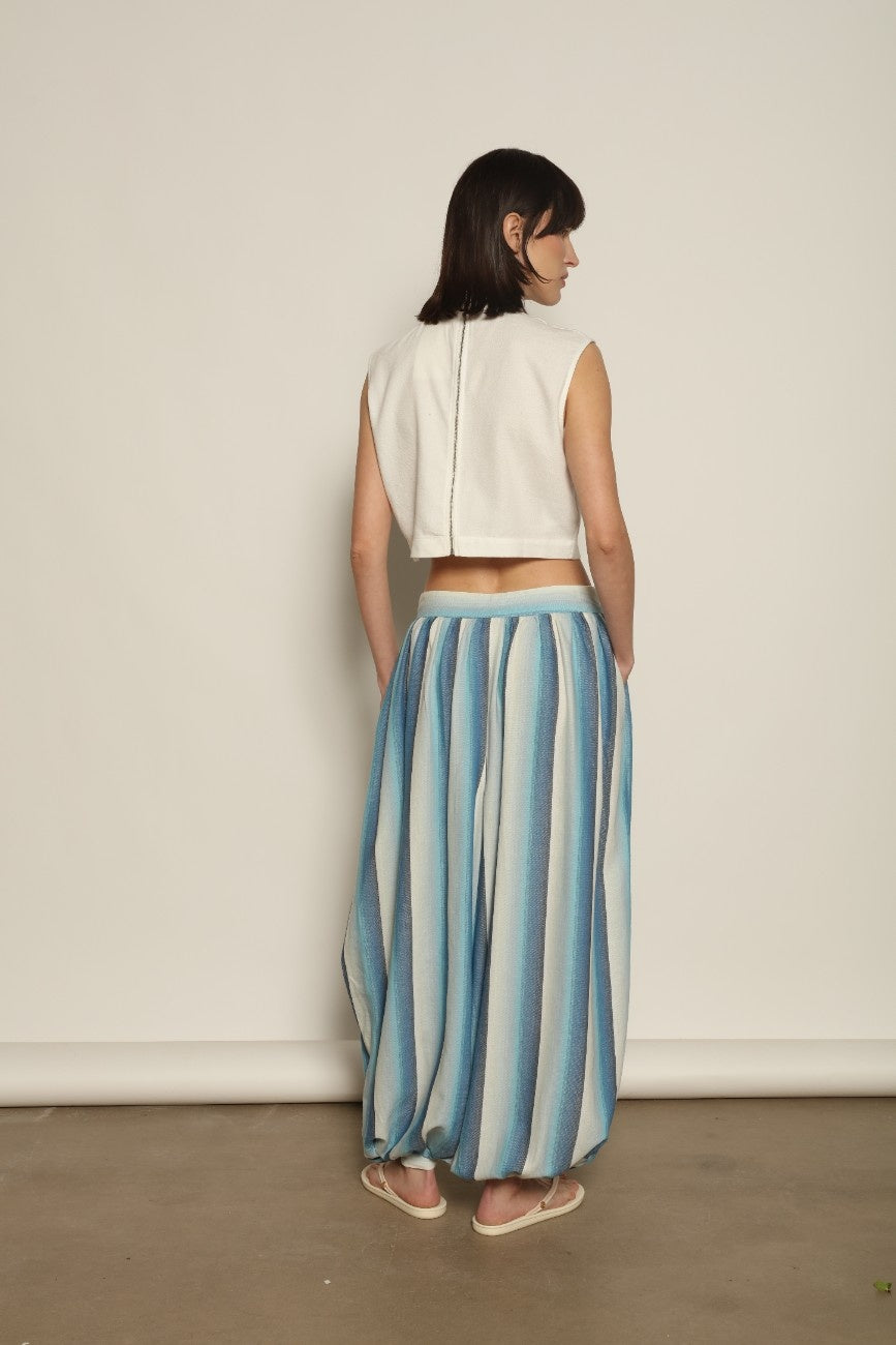 Model is wearing Marrakshi Life harem pants in striped handwoven cotton, voluminous relaxed fit lightweight breathable trousers from the curated selection of House of Woven Stories