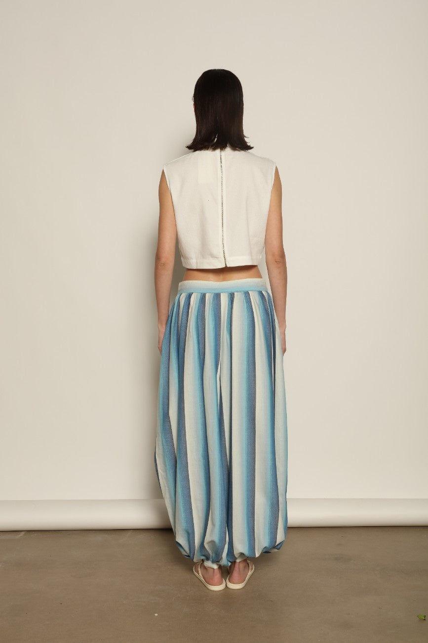 Model is wearing Marrakshi Life harem pants in striped handwoven cotton, voluminous relaxed fit lightweight breathable trousers from the curated selection of House of Woven Stories