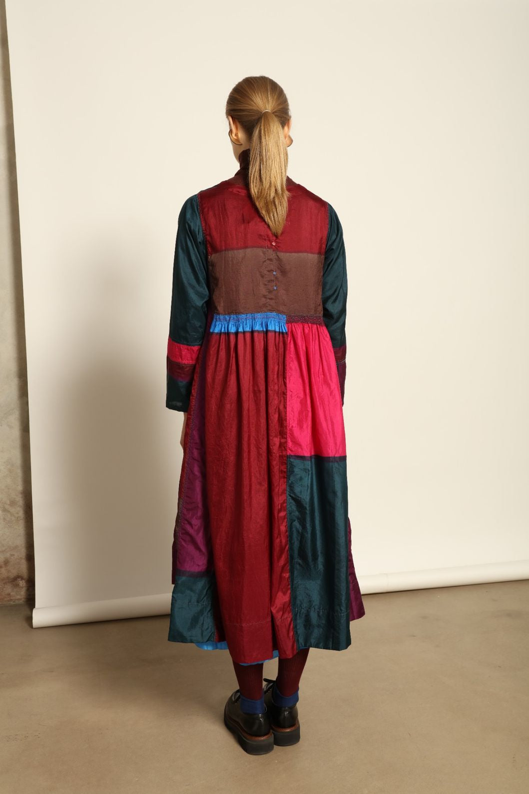 Model is wearing the Miraj 127 Silk Dress by Injiri, handwoven in India from pure silk with a fluid silhouette, soft sheen, and refined artisanal details for timeless elegance.