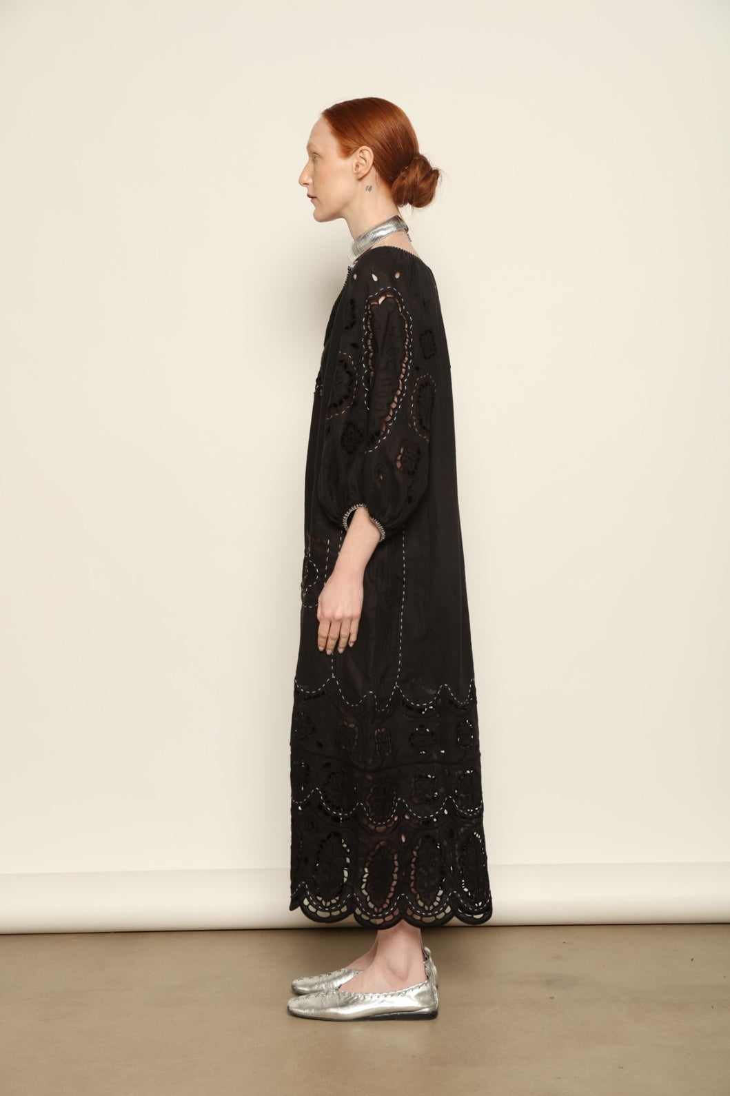 Model is wearing the My Sleeping Gypsy Merezhivo Long Dress, handcrafted from 100% linen with Richelieu embroidery and 24-carat bead accents, from the House of Nomad Stories selection.