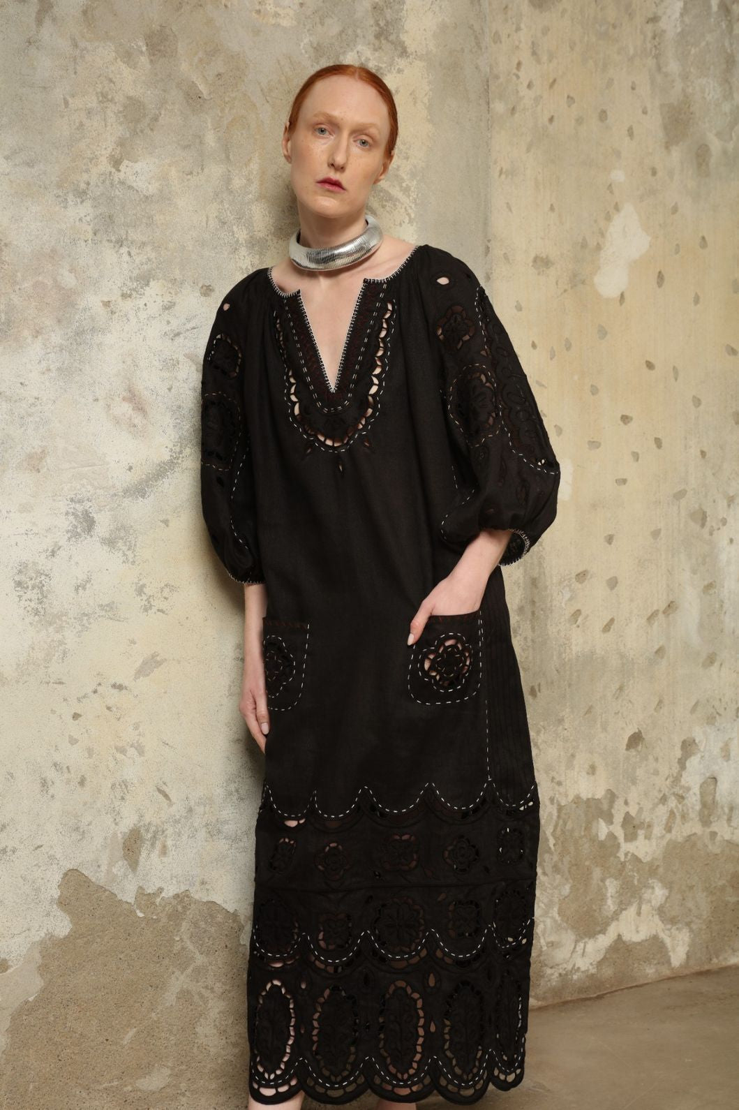 Model is wearing the My Sleeping Gypsy Merezhivo Long Dress, handcrafted from 100% linen with Richelieu embroidery and 24-carat bead accents, from the House of Nomad Stories selection.