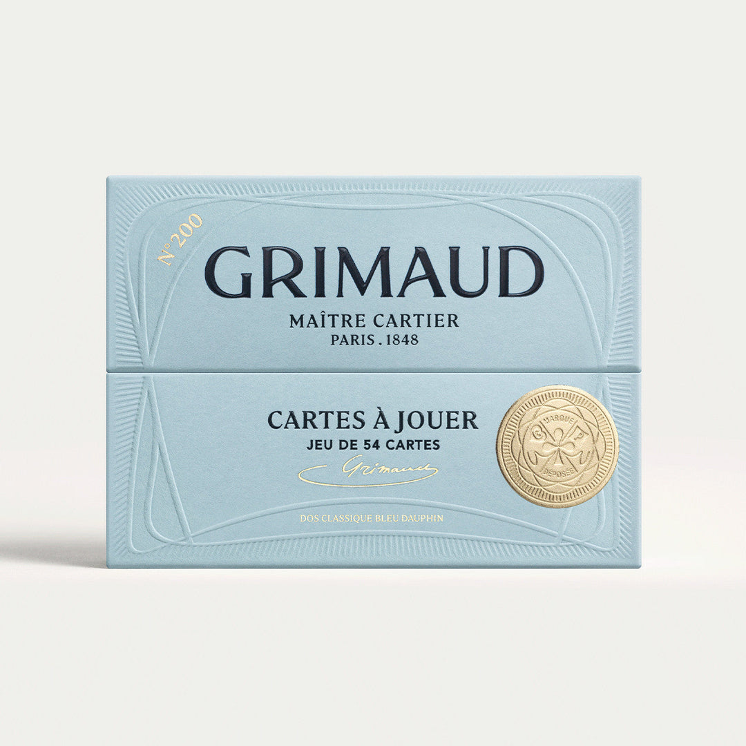 N°200 Cartes à Jouer by Grimaud Paris from the House of Nomad Stories selection, luxury Bridge and Poker playing cards in Dolphin Blue, made in France with gold foil detailing and illustrated design.