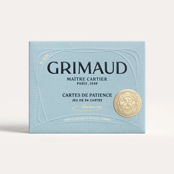 N°600 Cartes de Patience by Grimaud Paris from the House of Nomad Stories selection, luxury solitaire playing cards in Coral Red, made in France with gold-gilded corners and illustrated design.