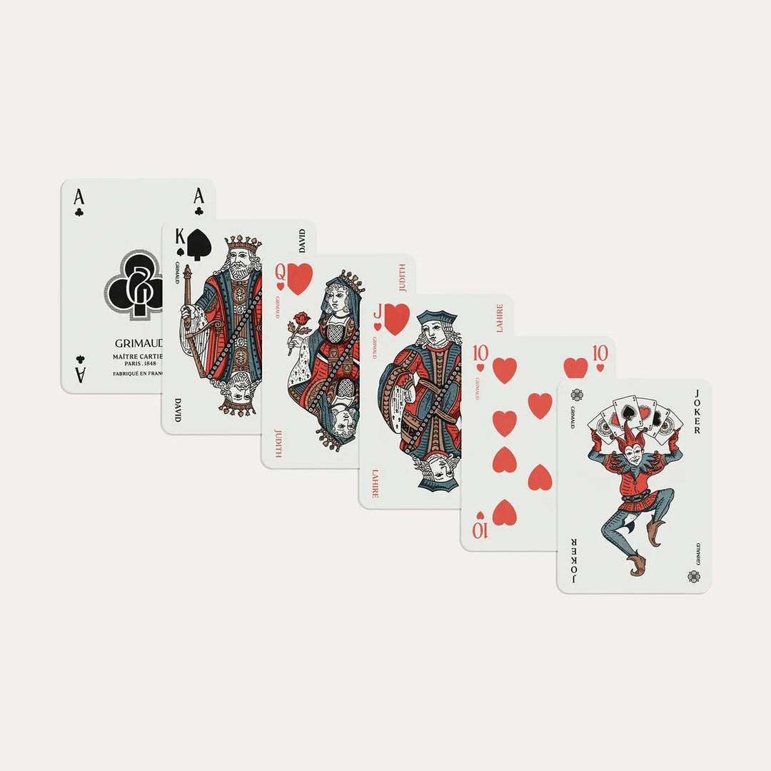 N°600 Cartes de Patience by Grimaud Paris from the House of Woven Stories selection, luxury solitaire playing cards in Dolphin Blue, made in France with gold-gilded corners and illustrated design.