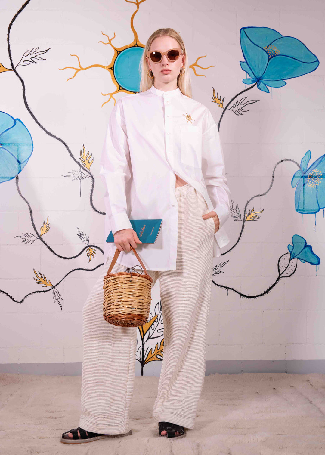 Full-length view of the Paiwand cream handloomed unisex trousers crafted from upcycled T-shirt knit scraps.