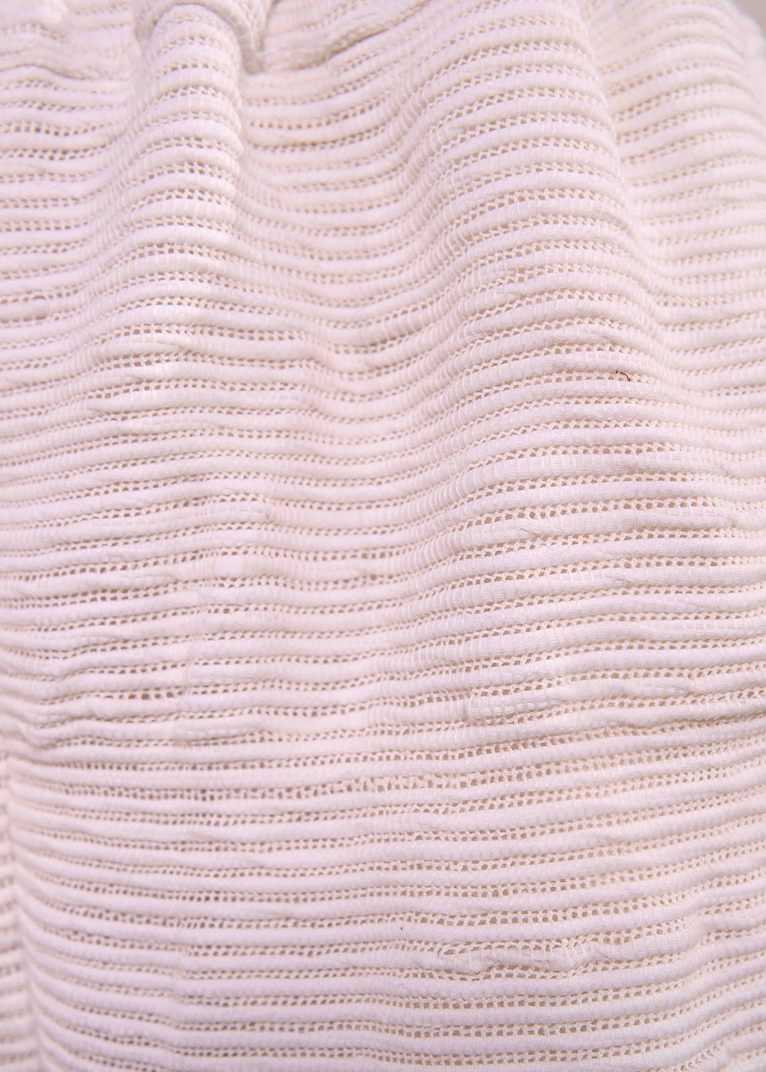 Textural detail of the upcycled cream handwoven fabric used for Paiwand Pajama Trousers.
