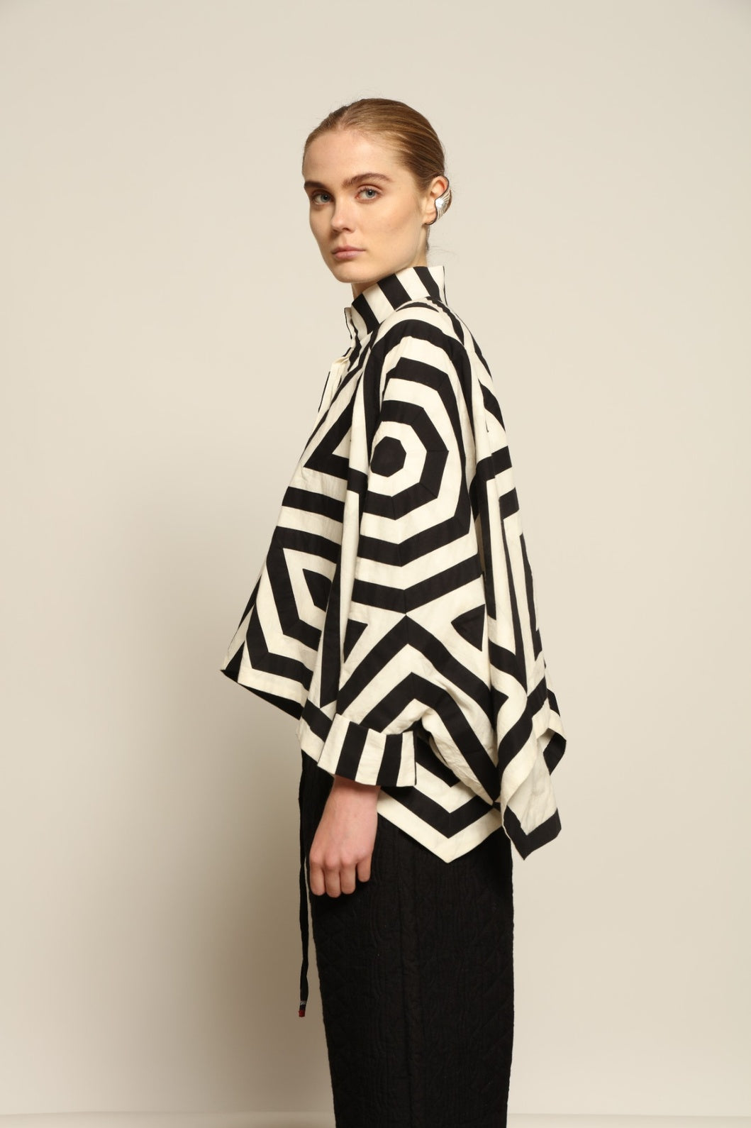 Model wearing Pure Cotton Tantra Black and White Jacket by Ka-Sha, part of the curated House of Woven Stories selection, handcrafted in India from premium cotton with hand-dyed appliqué detailing and a relaxed, artistic silhouette.