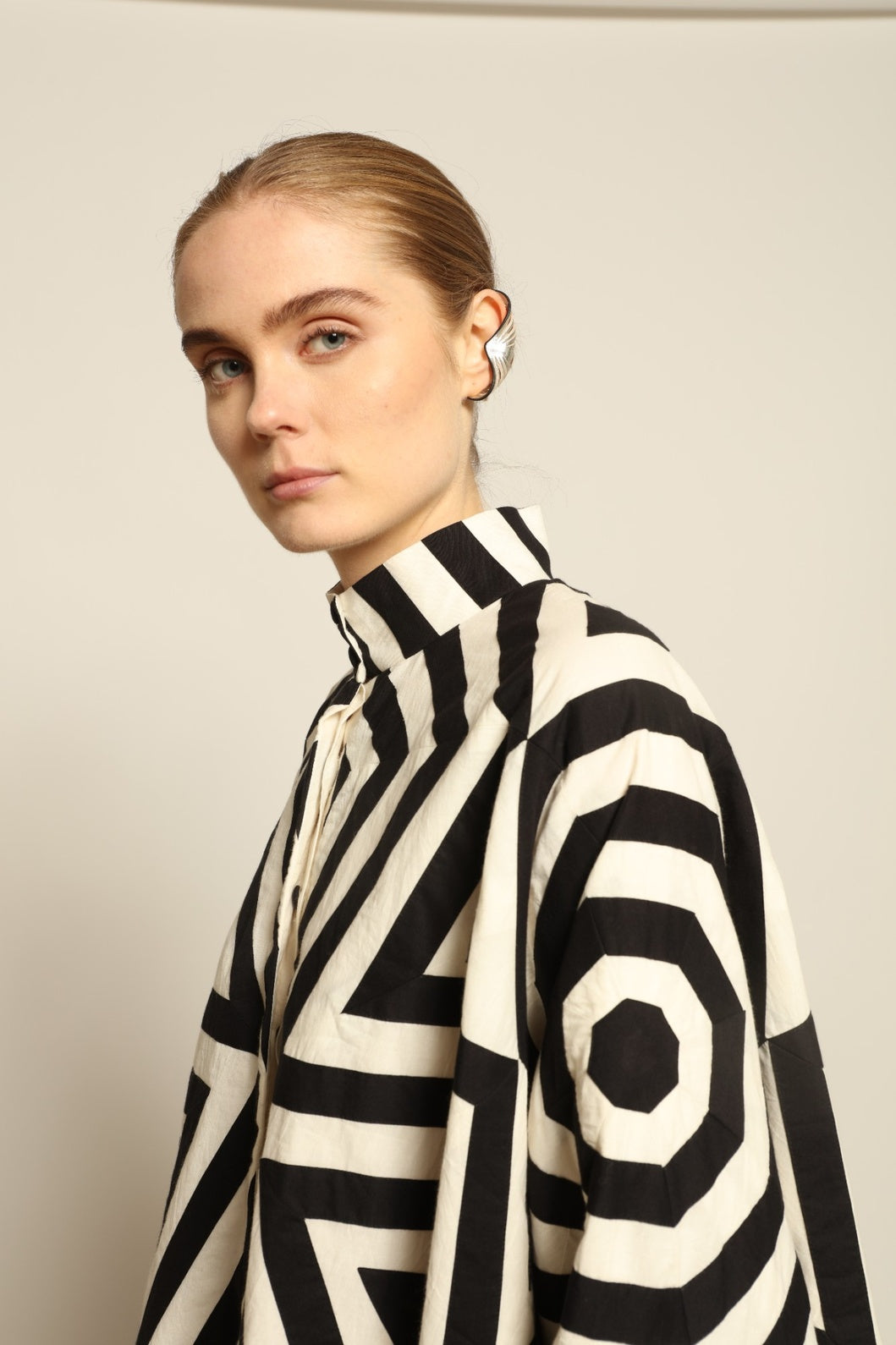 Model wearing Pure Cotton Tantra Black and White Jacket by Ka-Sha, part of the curated House of Woven Stories selection, handcrafted in India from premium cotton with hand-dyed appliqué detailing and a relaxed, artistic silhouette.