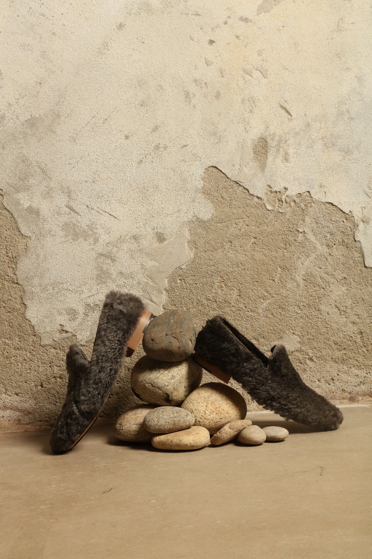 Model is wearing the Grey Wool Baboush Sharwit by House of Nomad Stories, handmade in Marrakesh from soft shearling sheep leather with a cushioned insole and durable rubber sole.