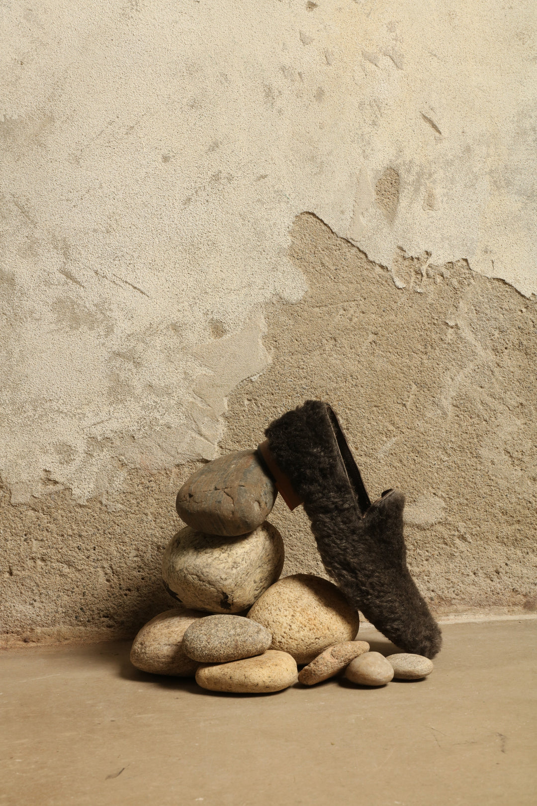 Model is wearing the Grey Wool Baboush Sharwit by House of Nomad Stories, handmade in Marrakesh from soft shearling sheep leather with a cushioned insole and durable rubber sole.